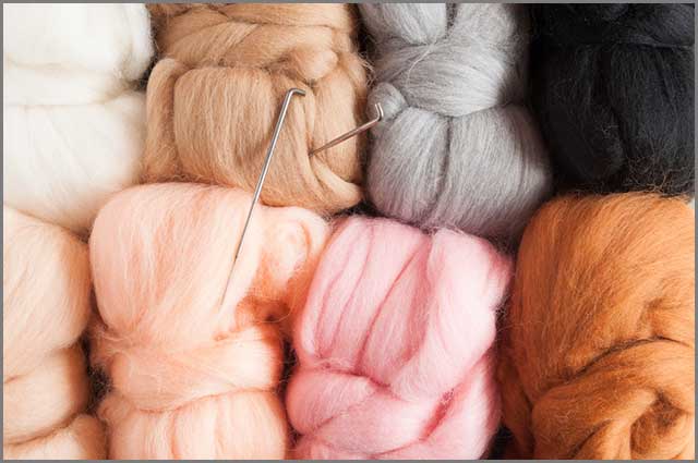 Wool material and felting needles from above