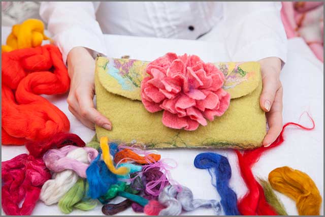A bag made of felt with pink decoration