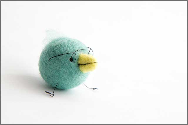 A round baby bird made of wool felt