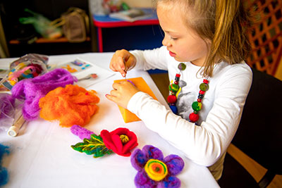 Caption: a young girl with felt decorations