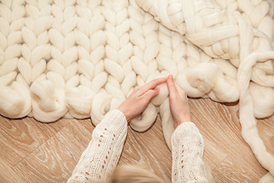 Woman Knitting Merino Wool