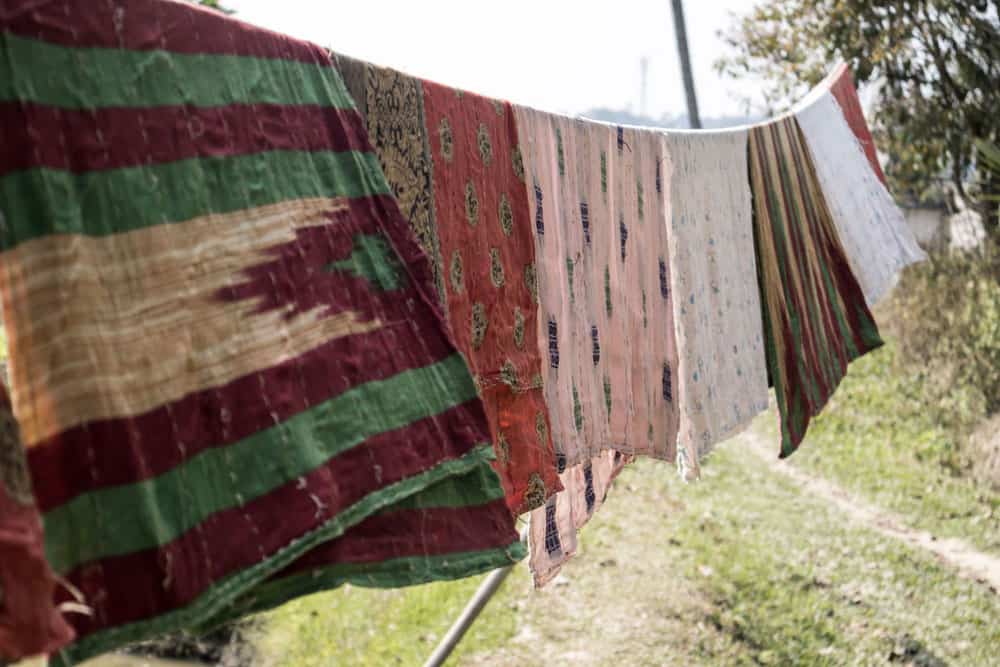 blankets hanging dry on a clothesline