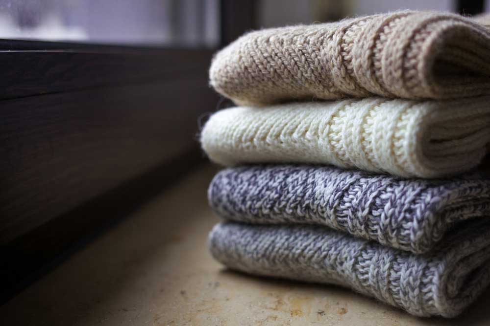 Wool Sweaters in a Pile