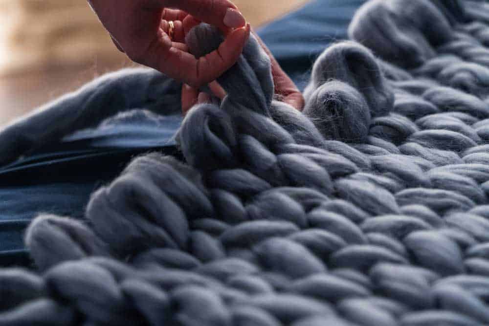 The process of knitting a blanket